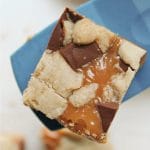 caramel chip bar on blue spatula