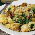 sausage orechiette casserole plated with fork