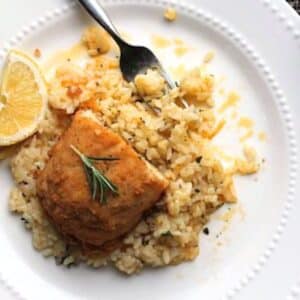 Lemon Herb Rice with chicken on top of rice.
