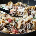 close up of serving spoon serving casserole