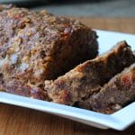 taco meatloaf prepared and on white serving platter sliced