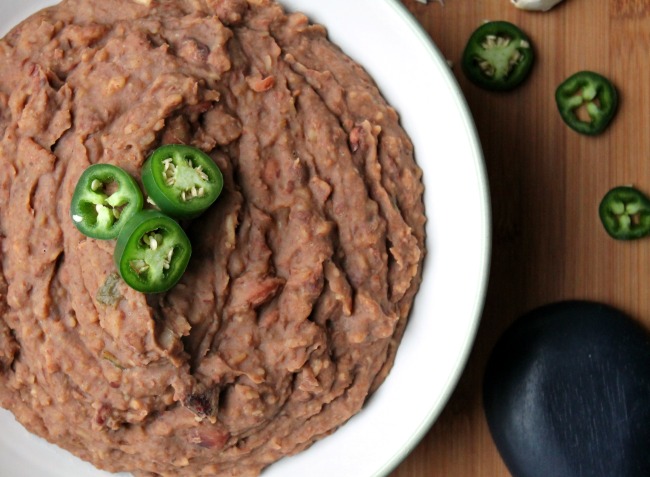 Instant Pot Refried Beans topped with jalapeno