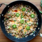 Top view of a black skillet with the prepared taco rice inside.