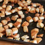 finished product baked croutons on sheet pan