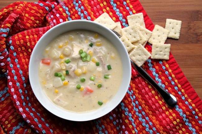 Creamy Chicken Vegetable Soup in a bowl with crackers