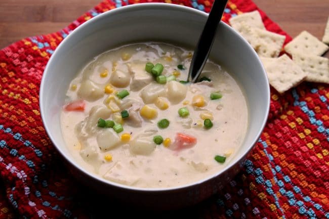 creamy chicken soup in a bowl with spoon