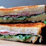 Cooked grilled cheese, sliced slice facing out.