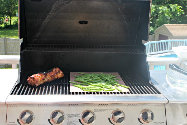 Grilled Pork Loin with Green Beans cooking on grill