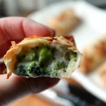 broccoli cheese egg roll close up in half