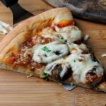slice caramelized onion and mushroom pizza