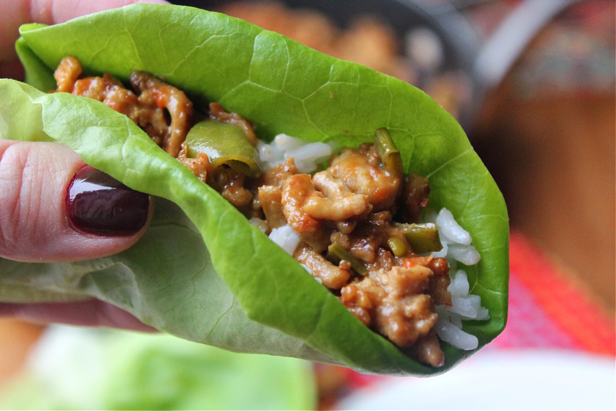 lettuce wrap filled with ground chicken filling and rice