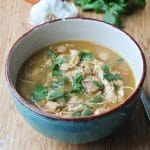 salsa verde chicken chili in bowl topped with cilantro