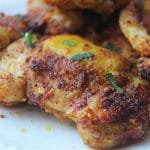 close up chicken cooked on white plate