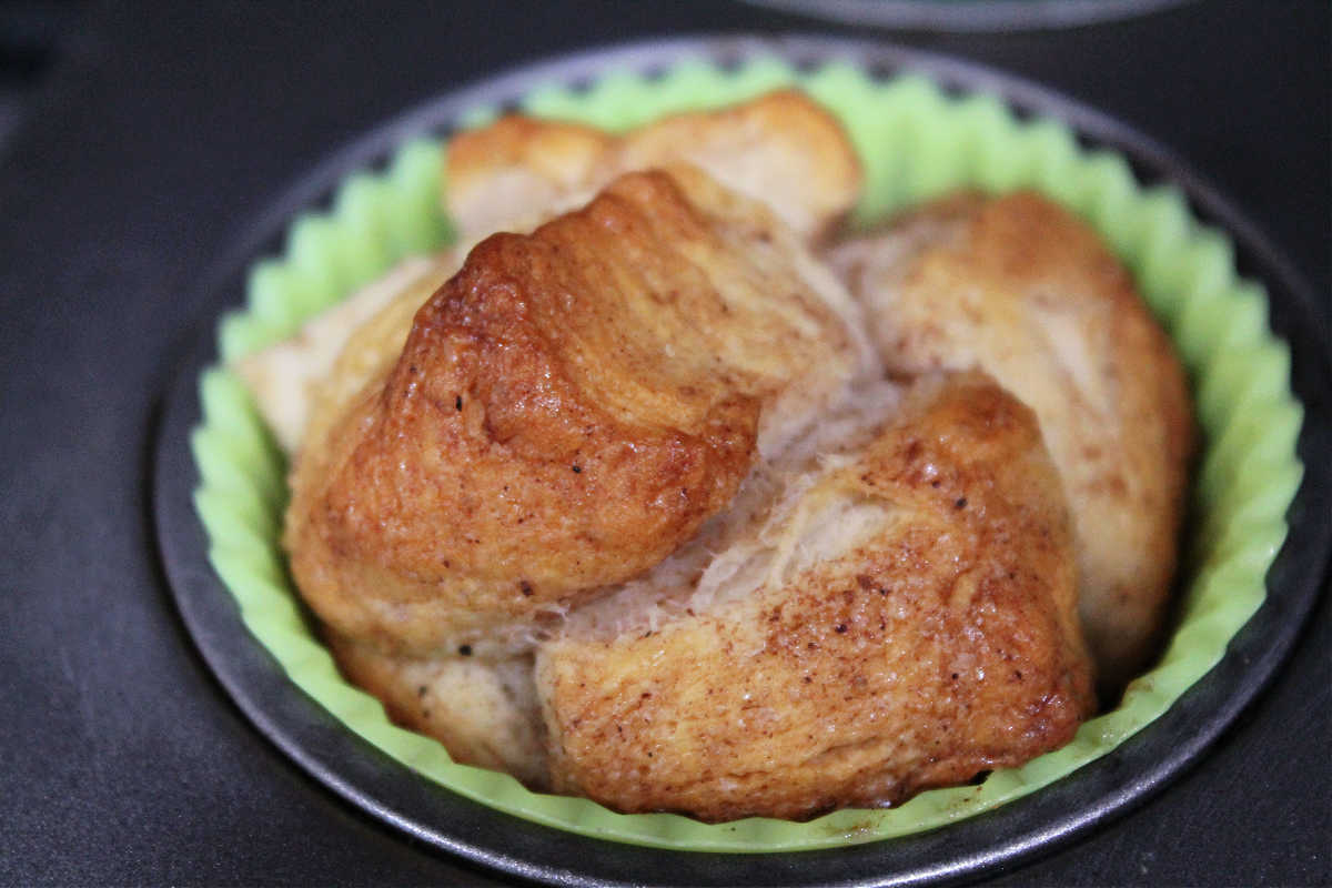 cooked monkey bread cup closeup still in pan