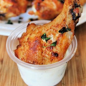 chicken wing in cup of ranch dressing