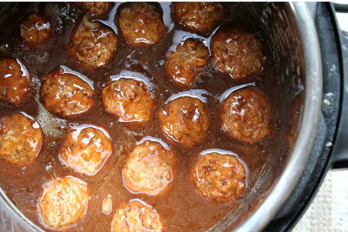 Cooked meatballs in gravy still in the instant pot.