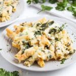 Prepared casserole portioned out on a white dinner plate.
