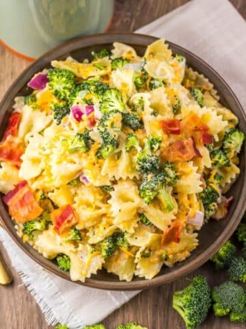 Prepared pasta salad in a brown serving bowl.